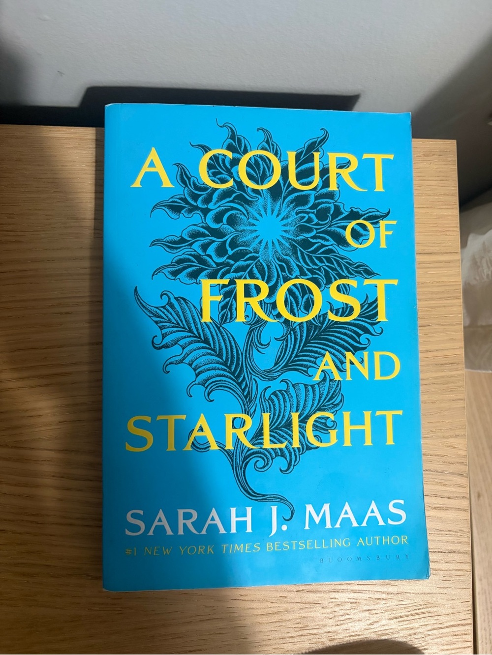 A Court of Frost and Starlight by Sarah J. Maas - Bright Blue & Yellow softcover